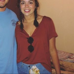 Orange tee with hole details